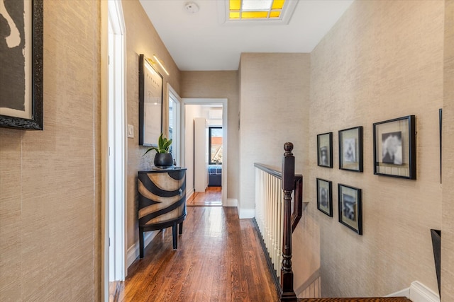 corridor with dark hardwood / wood-style flooring