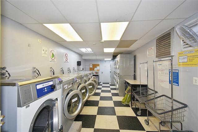 common laundry area with tile patterned floors, separate washer and dryer, and stacked washing maching and dryer