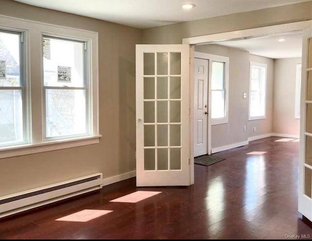 entryway featuring dark hardwood / wood-style floors and baseboard heating