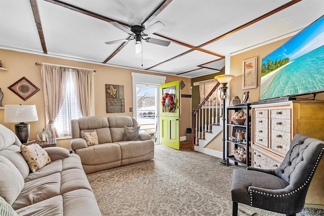 carpeted living room with ceiling fan and a wealth of natural light