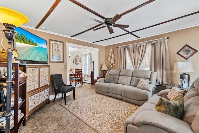 living room with ceiling fan, carpet flooring, and ornamental molding