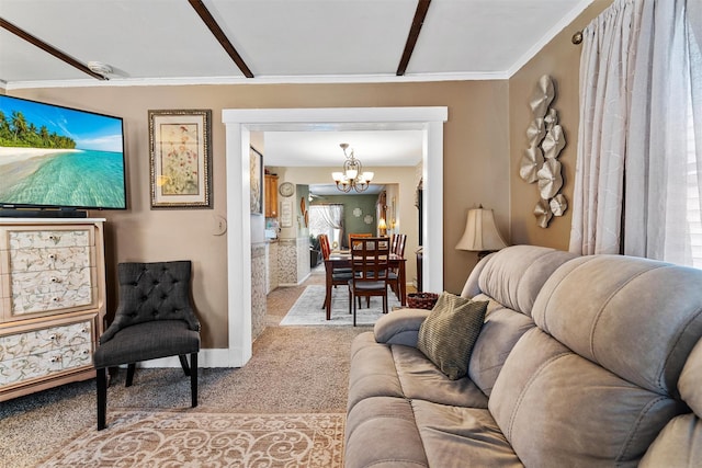 living room with a chandelier, crown molding, and light carpet