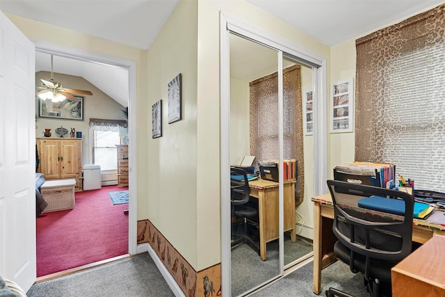 carpeted office with baseboard heating, ceiling fan, and lofted ceiling