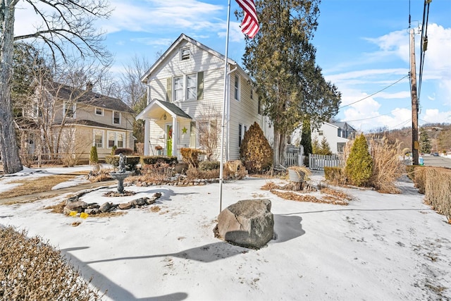 view of front of house featuring fence