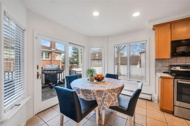 dining area with light tile patterned flooring, a baseboard heating unit, and recessed lighting