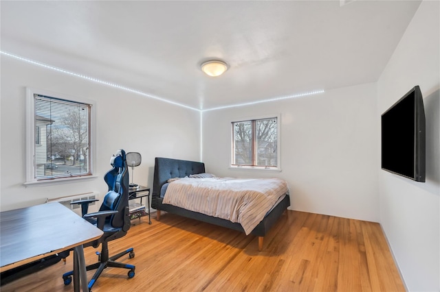 bedroom featuring light wood finished floors