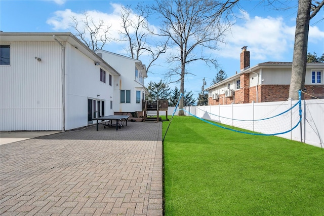 view of yard featuring a patio area and fence