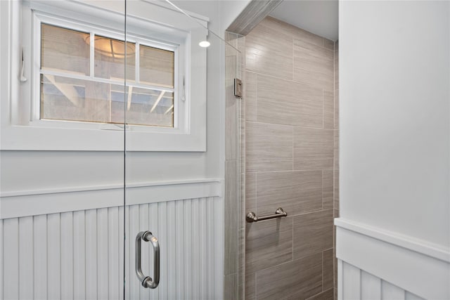 bathroom with tiled shower