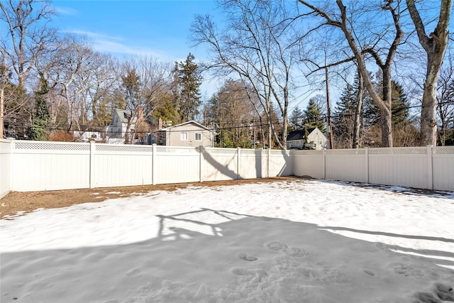 view of yard covered in snow