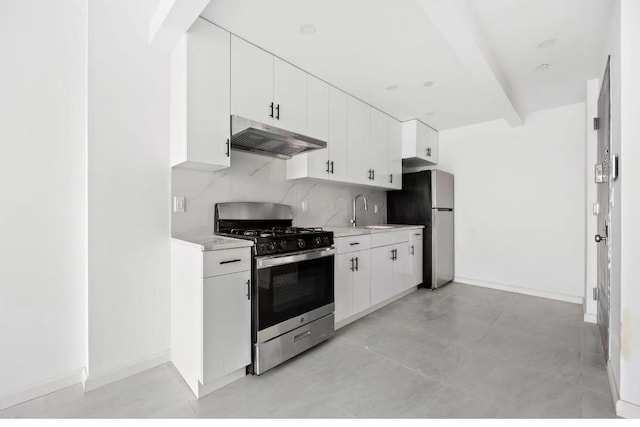 kitchen with white cabinetry, sink, tasteful backsplash, and appliances with stainless steel finishes