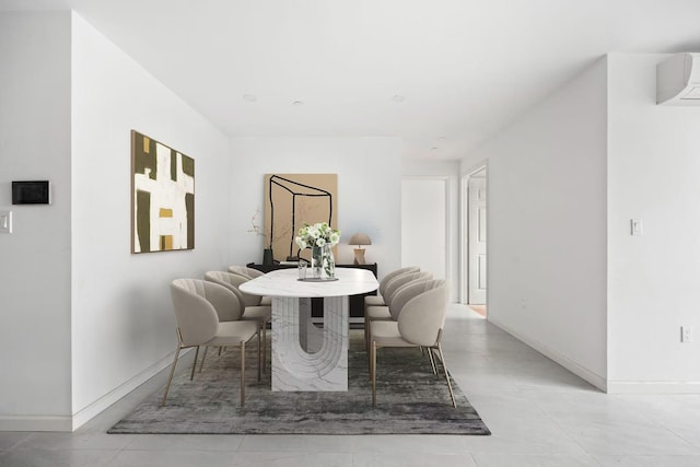 dining space with a wall mounted air conditioner