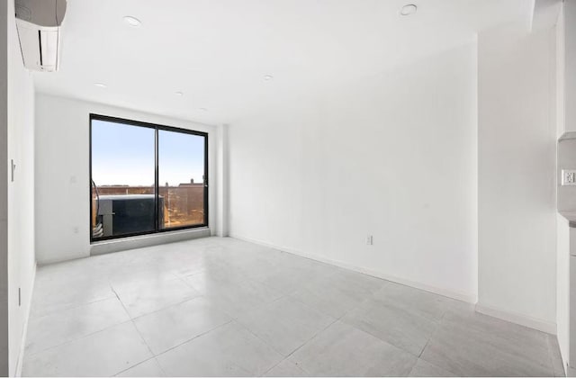 unfurnished room featuring a wall mounted air conditioner