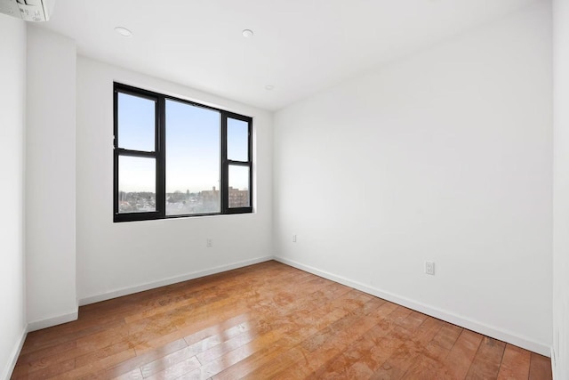 spare room with light hardwood / wood-style flooring