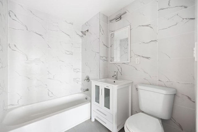 full bathroom featuring vanity, toilet, and tiled shower / bath