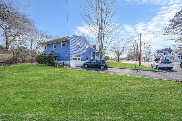 view of yard featuring a garage