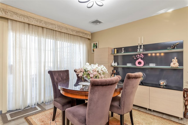 dining area featuring visible vents