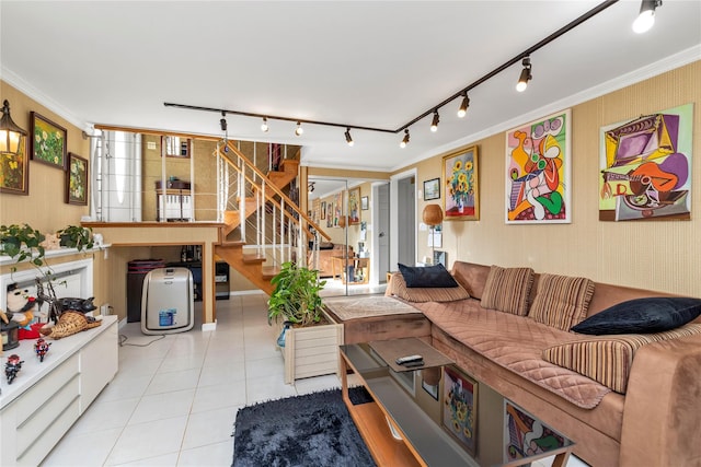 living room with light tile patterned floors, stairway, rail lighting, and crown molding