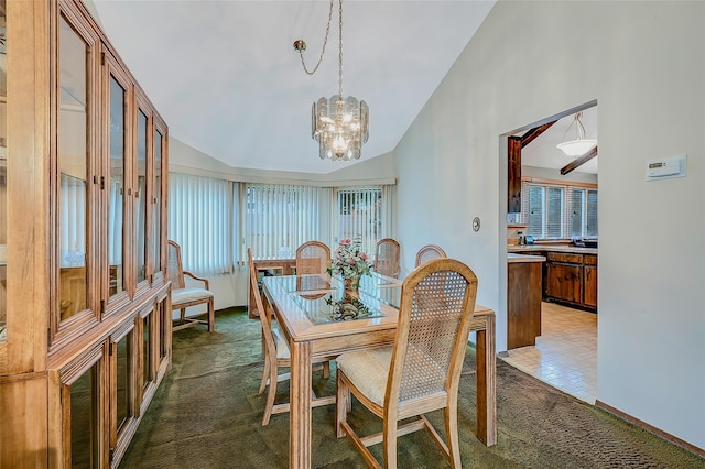 dining room featuring lofted ceiling, a notable chandelier, and dark colored carpet