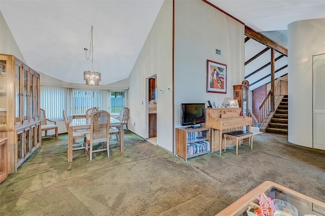 dining area featuring high vaulted ceiling, carpet flooring, and an inviting chandelier