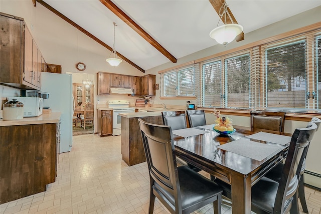 dining space featuring beam ceiling and high vaulted ceiling