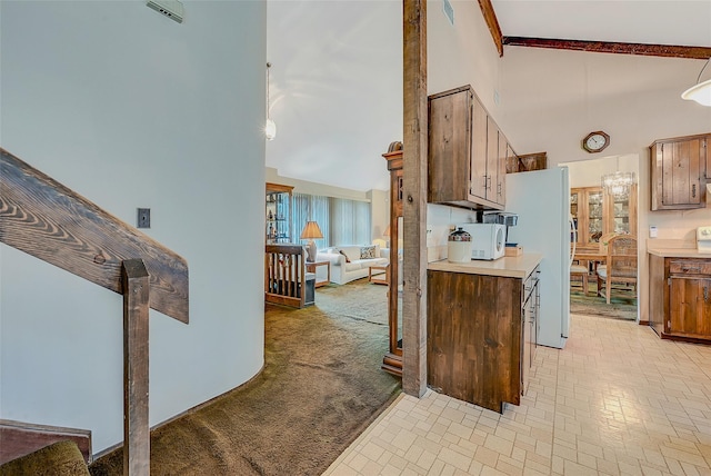 kitchen with high vaulted ceiling, light carpet, and white appliances