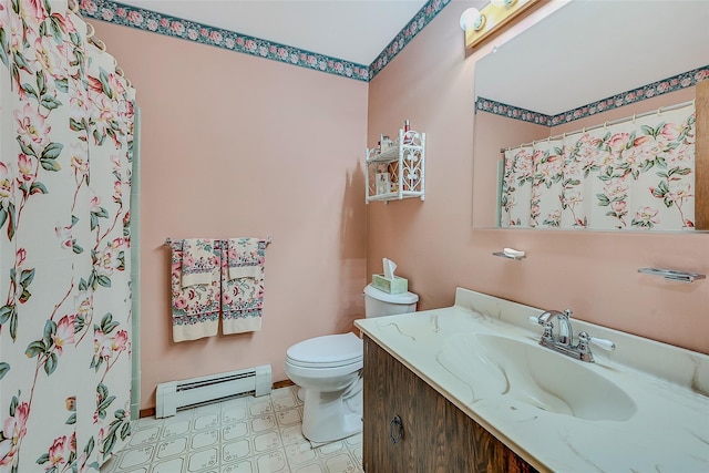 bathroom with a baseboard radiator, vanity, and toilet