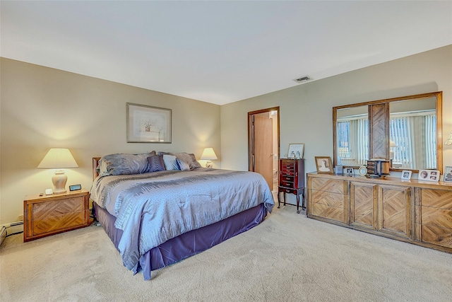 bedroom featuring light carpet