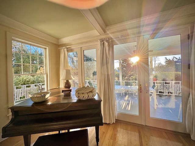 doorway with hardwood / wood-style floors, crown molding, french doors, and beamed ceiling