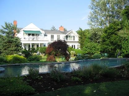 back of property featuring a balcony