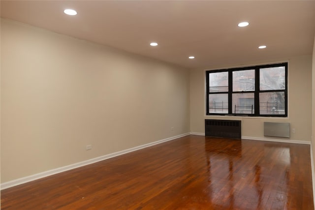 1275 E 51st St Unit 3Y, Brooklyn, NY 11234 - empty room with radiator and dark wood-type flooring