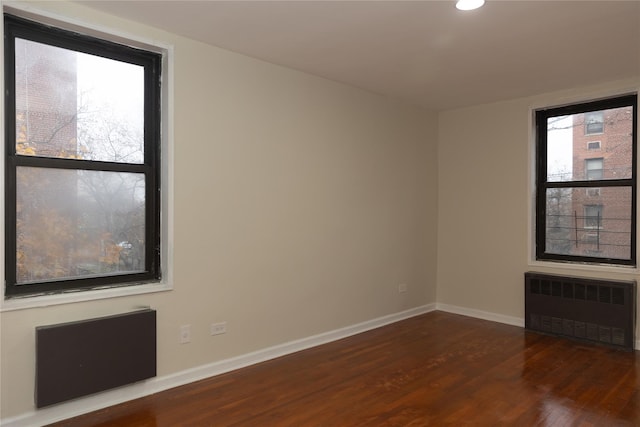1275 E 51st St Unit 3Y, Brooklyn, NY 11234 - spare room featuring dark hardwood / wood-style floors and radiator