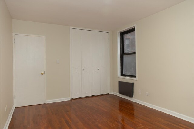 1275 E 51st St Unit 3Y, Brooklyn, NY 11234 - unfurnished bedroom with dark hardwood / wood-style flooring and a closet
