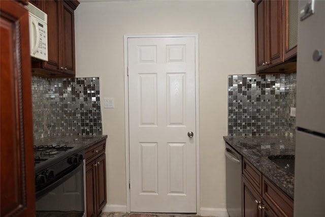 1275 E 51st St Unit 3Y, Brooklyn, NY 11234 - kitchen with dark stone countertops, white appliances, and decorative backsplash