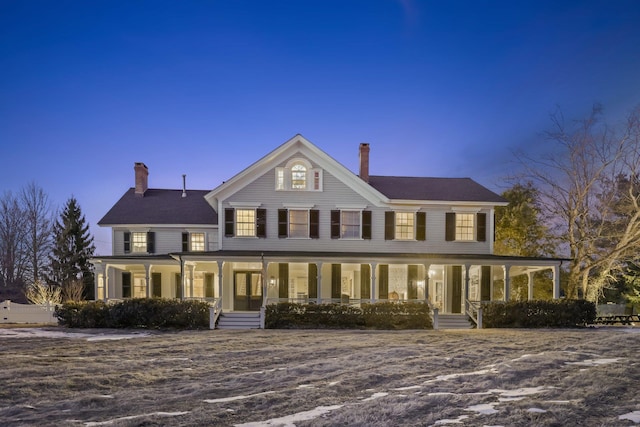 view of front of property featuring a porch and a chimney