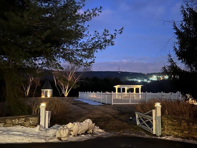 view of front of house featuring fence and a gazebo