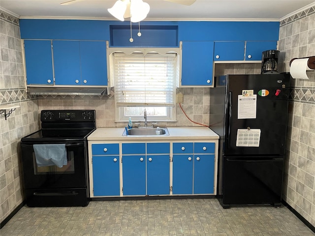 kitchen featuring light countertops, a sink, blue cabinetry, and black appliances