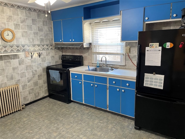 kitchen with a sink, light countertops, blue cabinetry, black appliances, and radiator heating unit