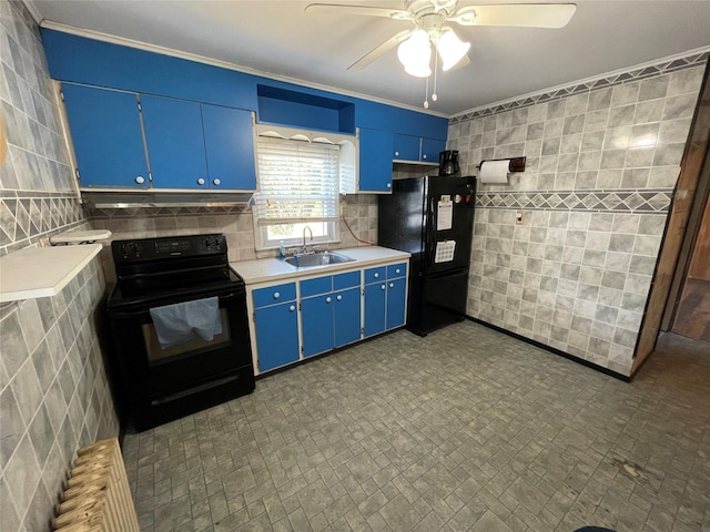 kitchen featuring tile walls, light countertops, a sink, blue cabinets, and black appliances