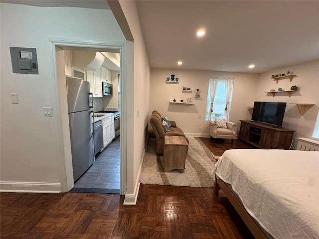 555 Broadway Ave Unit 1H, Hastings-On-Hudson, NY 10706 - bedroom with freestanding refrigerator, electric panel, and recessed lighting