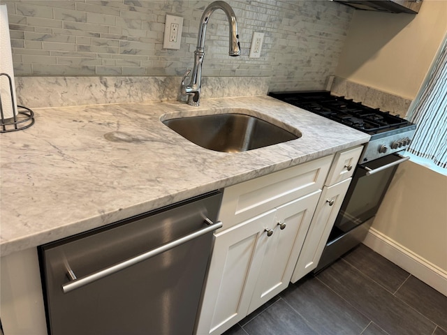 555 Broadway Ave Unit 1H, Hastings-On-Hudson, NY 10706 - kitchen with appliances with stainless steel finishes, tasteful backsplash, white cabinetry, and light stone countertops