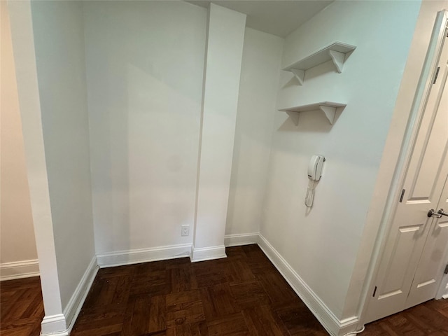 555 Broadway Ave Unit 1H, Hastings-On-Hudson, NY 10706 - laundry room featuring baseboards