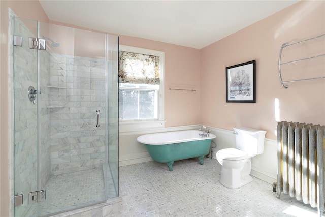 bathroom featuring radiator, toilet, and separate shower and tub