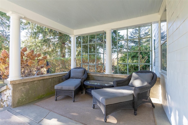 sunroom featuring decorative columns