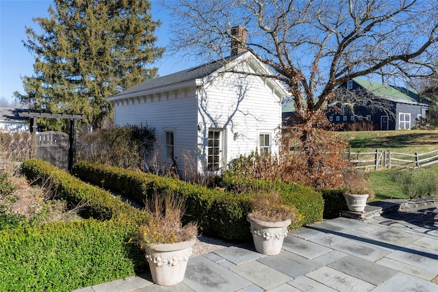 view of side of property featuring a patio