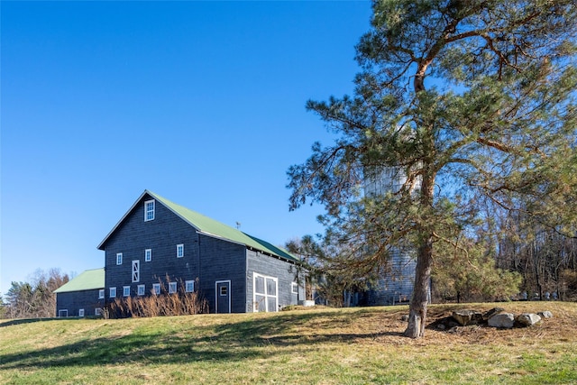 view of side of property with a yard