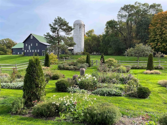 view of property's community with a yard and a rural view