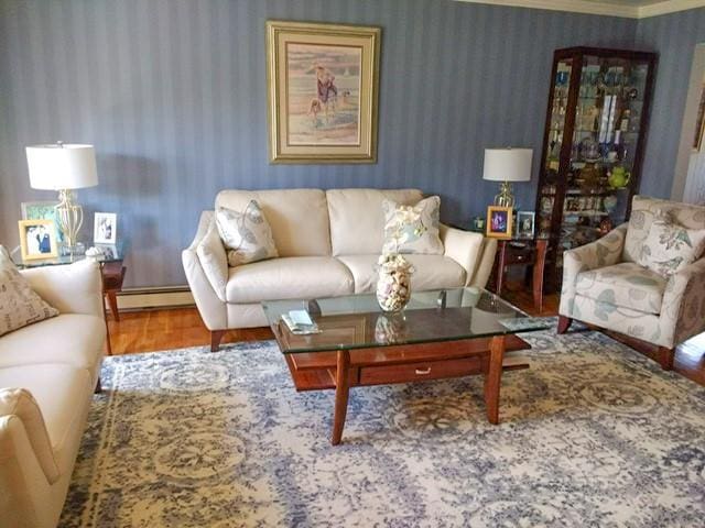 living room featuring hardwood / wood-style floors and a baseboard heating unit