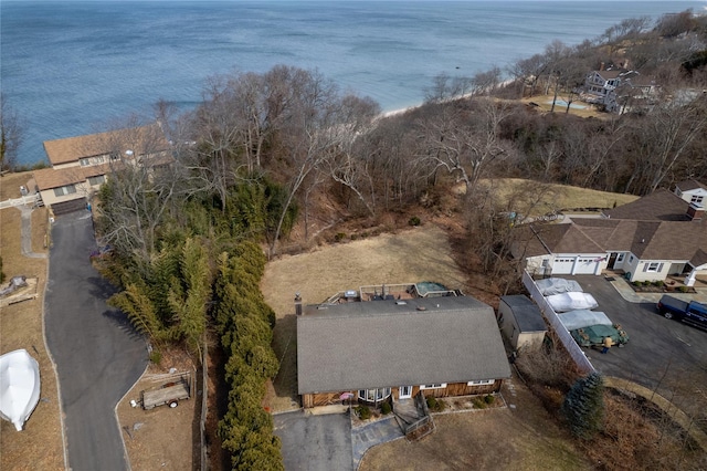 birds eye view of property featuring a water view