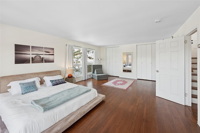 bedroom featuring dark wood-style flooring