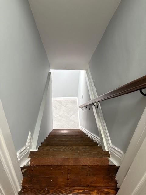 staircase featuring hardwood / wood-style flooring